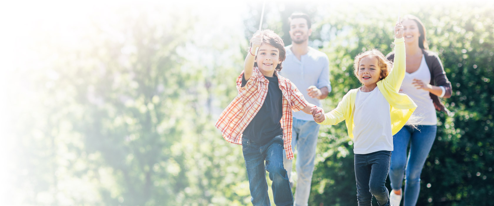 Happy kids running with a windmill toy