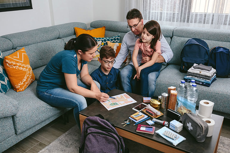 A family of four in their living room preparing for the unexpected