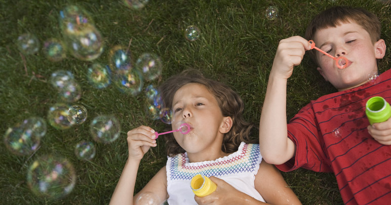 Children blowing bubbles