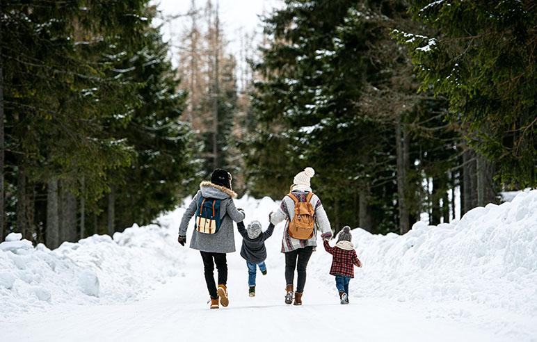 Family walking in t he snow outside