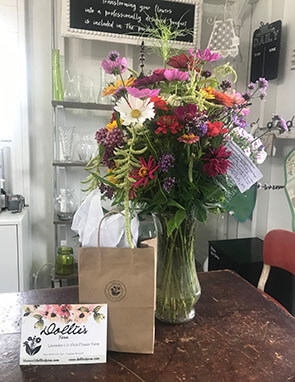 Gift Bouquet with flowers and gift bag that says Dollie's Farm
