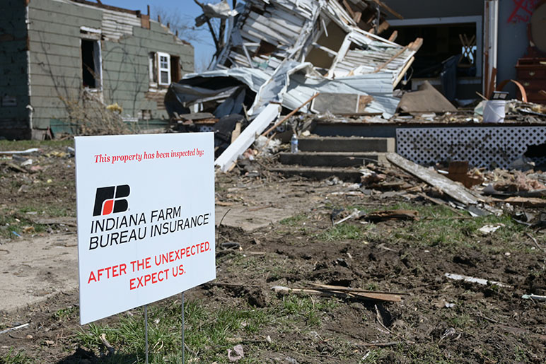 Indiana Farm Bureau Insurance after the unexpected, expect us sign in front of a home in Indiana after severe weather