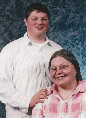 Matt Morley and his Mom in a photograph with Matt's hand on her shoulder