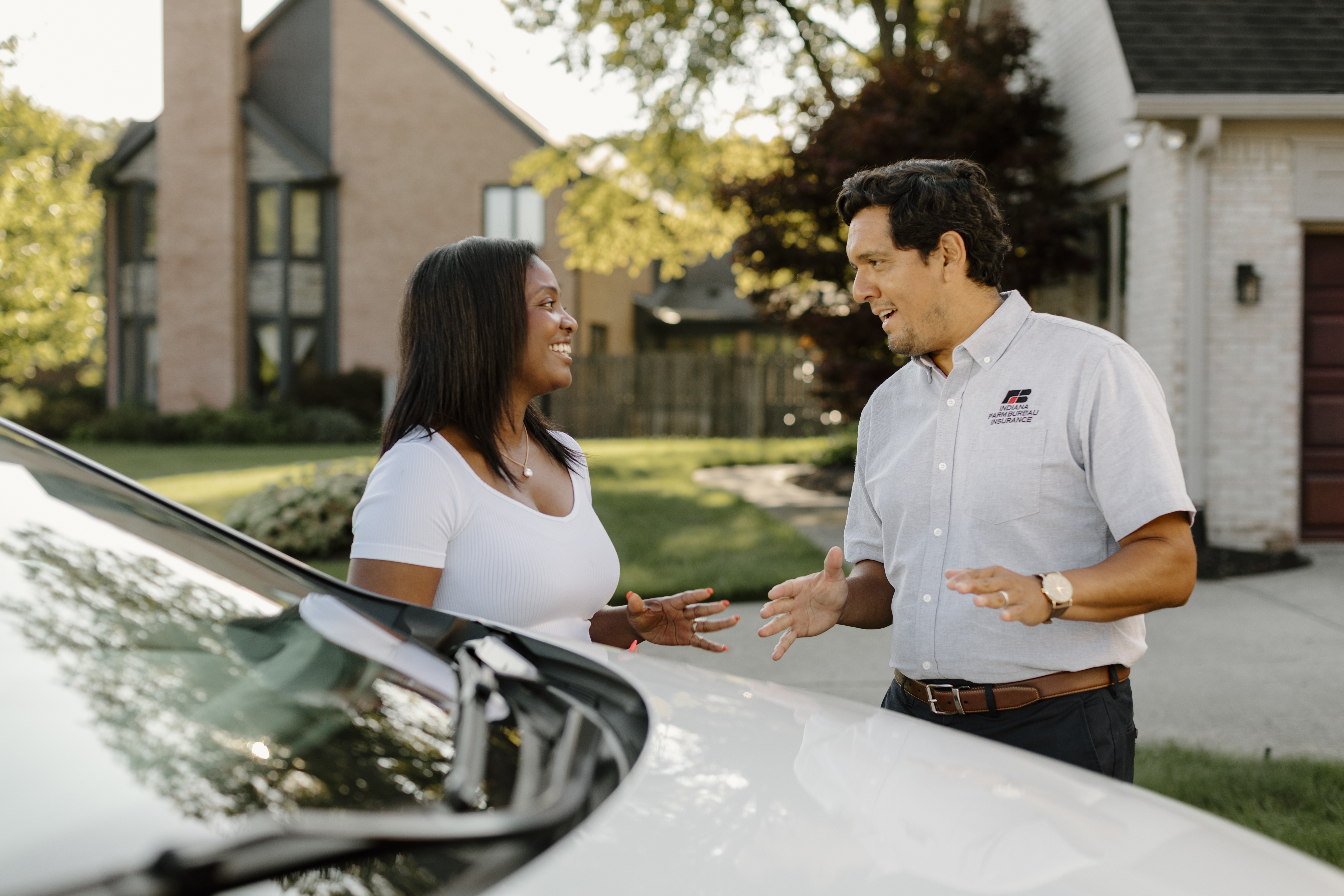 Indiana Farm Bureau Insurance agent meets with a client at their home.