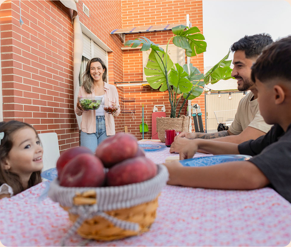 Family sitting on table smiling