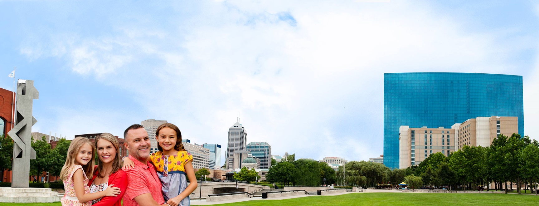 Happy family in front of Indiana blue skyline