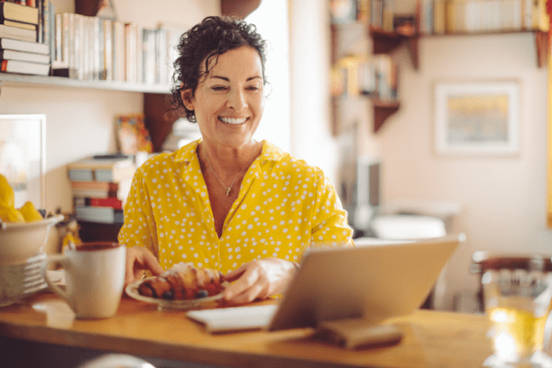 Smiling women checking beneficiary checklist on her ipad