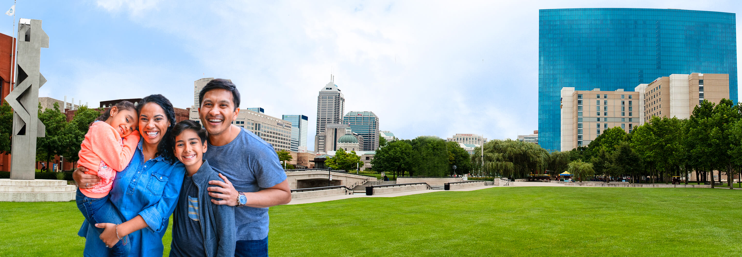 Happy family in front of Indiana blue skyline