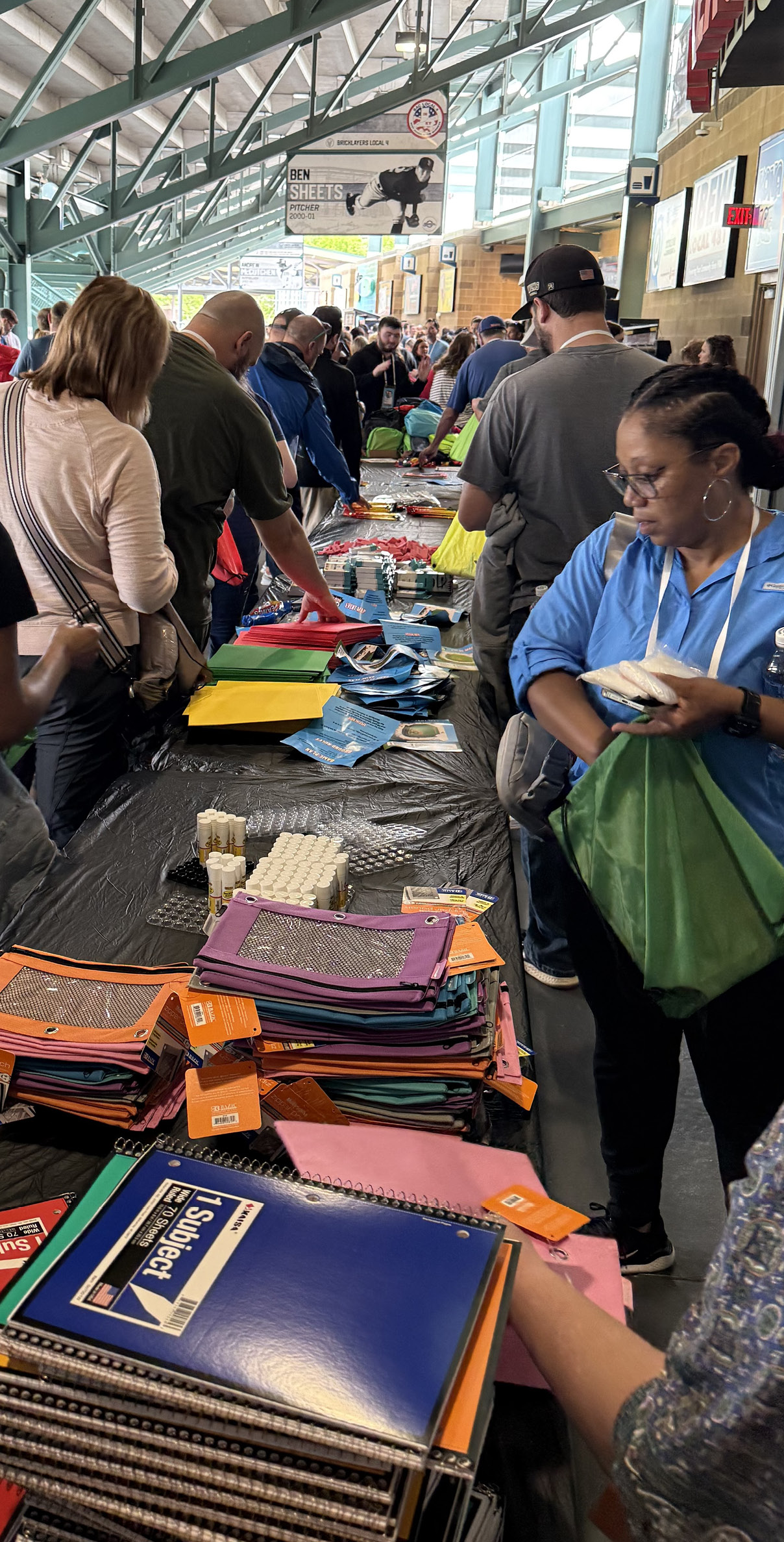 Indiana Farm Bureau Insurance employees pack backpacks as a service project